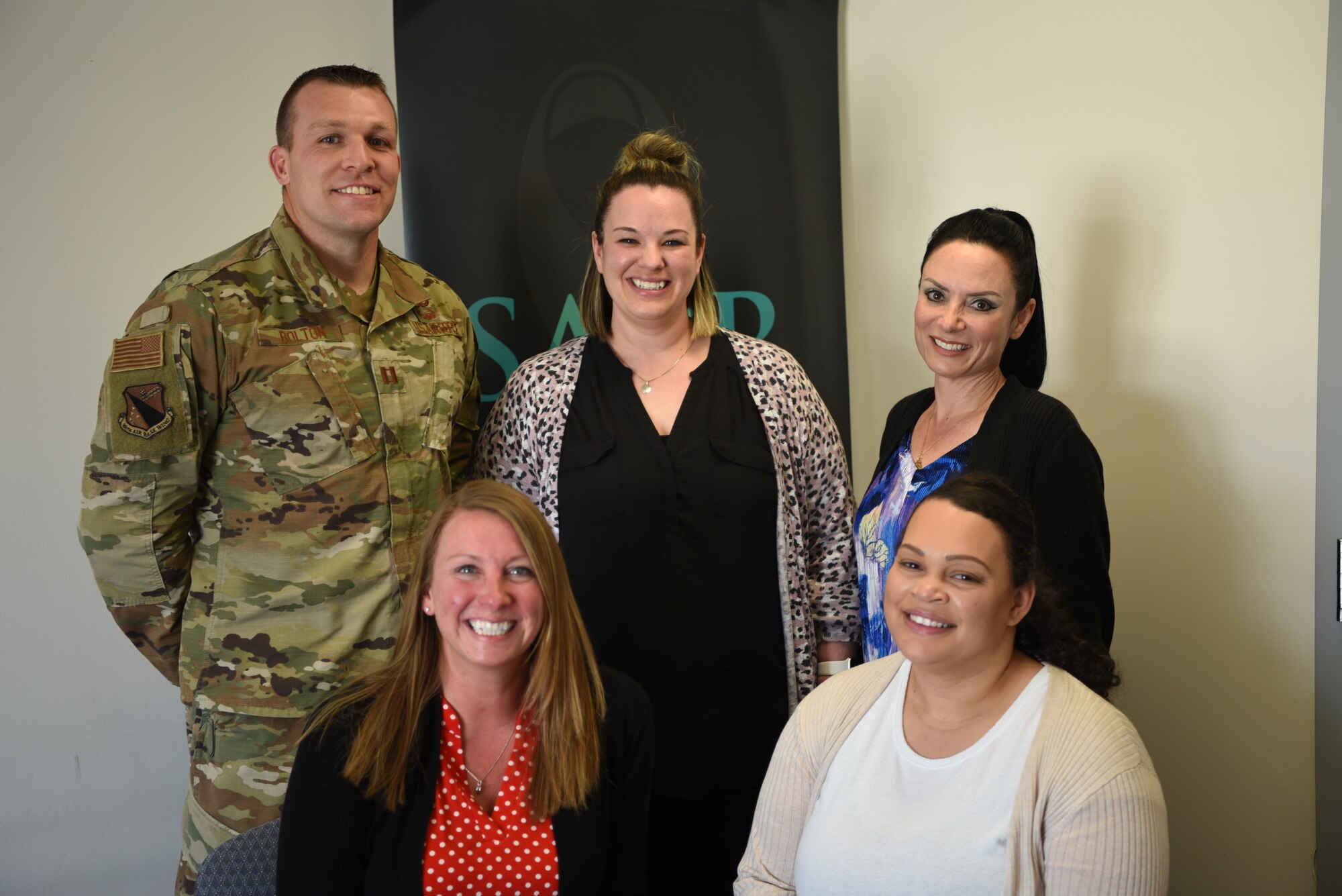 Wright-Patterson Air Force Base Sexual Assault Prevention and Response team
members Capt. William Bolton (left), April Barrows, Annamae Willis, Kelly Hebert and Jazmyn
Turner pose for a photo in their office May 12. The team won the 2021 Department of the Air
Force Exceptional SAPR Team award for their effective and dedicated care for Wright-Patt
Airmen. (U.S. Air Force photo by Airman 1st Class Jack Gardner)