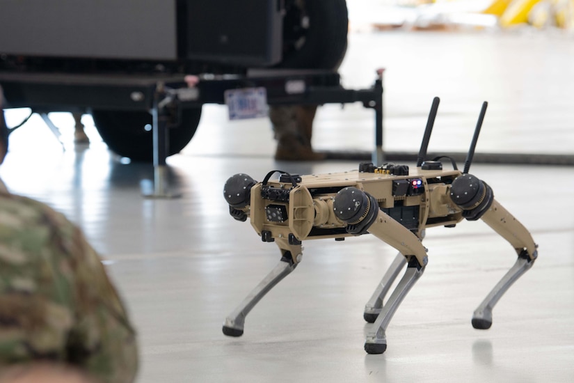 An unmanned ground vehicle stands on the floor.