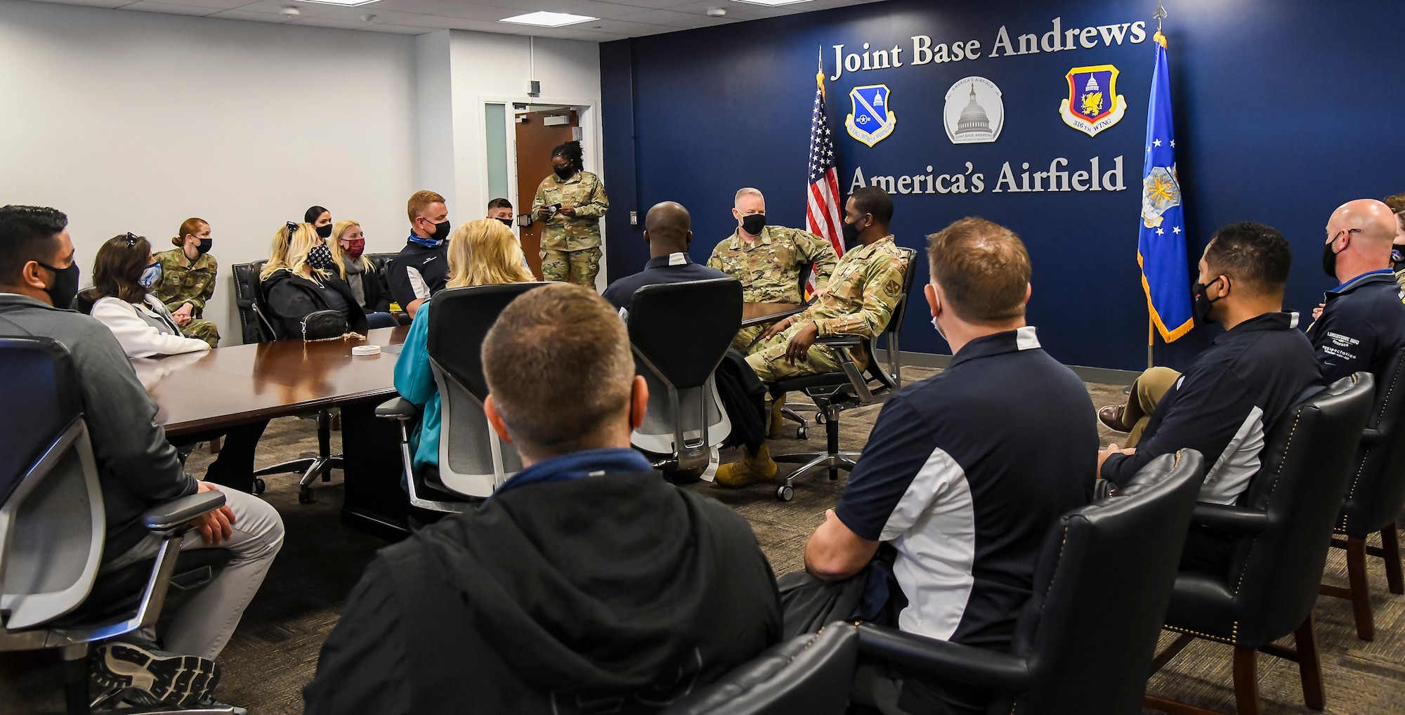 Col. Tyler Schaff, 316th Wing and installation commander, and Chief Master Sgt. Ezekiel Ross, 316th Wing command chief, provide a mission brief to visiting Dover Air Force Base honorary commanders at Joint Base Andrews, Maryland, May 10, 2021. The 316th Wing is the host wing for JBA and provides support for five wings, three headquarters, more than 80 tenant organizations,148 geographically separated units, 6,500 Airmen in the Pentagon, as well as 60,000 Airmen and families in the National Capital Region and around the world. (U.S. Air Force photo by Airman 1st Class Stephani Barge)
