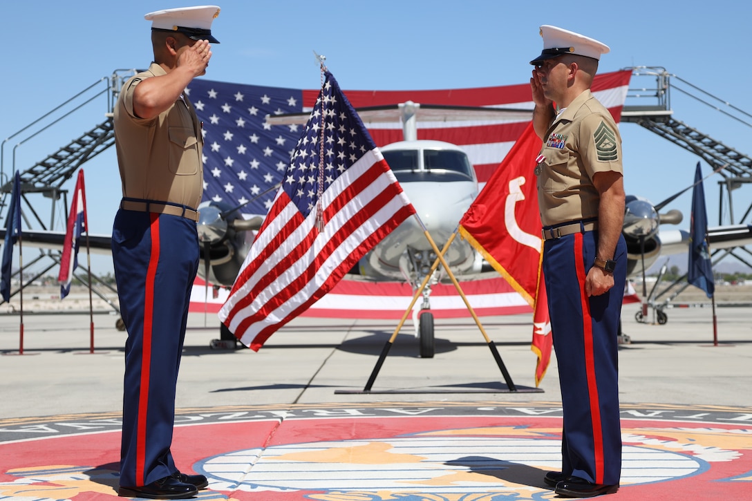 U.S. Marine Corps Master Sgt. Chris Medina (right) salutes during his retirement ceremony at Marine Corps Air Station Yuma, April 30, 2021. The ceremony honored MSgt Medina and the sacrifice he made while serving in the Marine Corps. (U.S. Marine Corps photo by LCpl. Matthew Romonoyske-Bean)