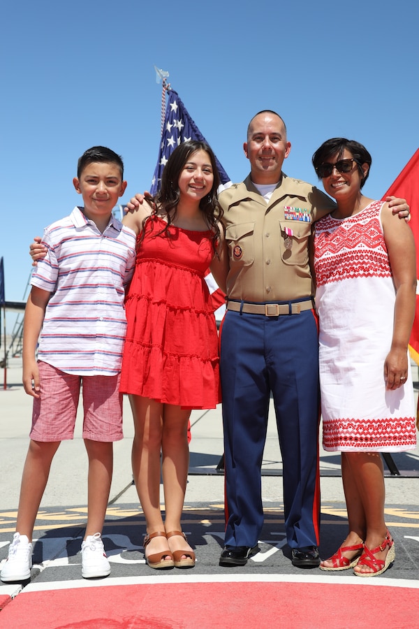 U.S. Marine Corps Master Sgt. Chris Medina poses for a picture with his family after a retirement ceremony at Marine Corps Air Station Yuma, April 30, 2021.