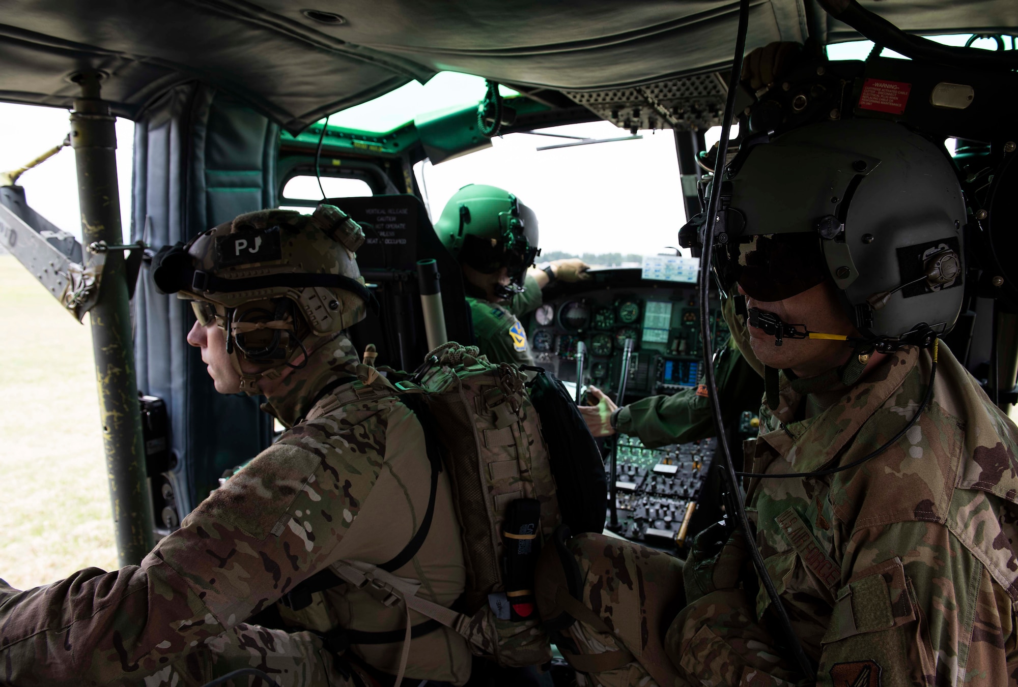 U.S. Air Force Airmen prepare for a fast rope exercise aboard a UH-1N Iroquois helicopter