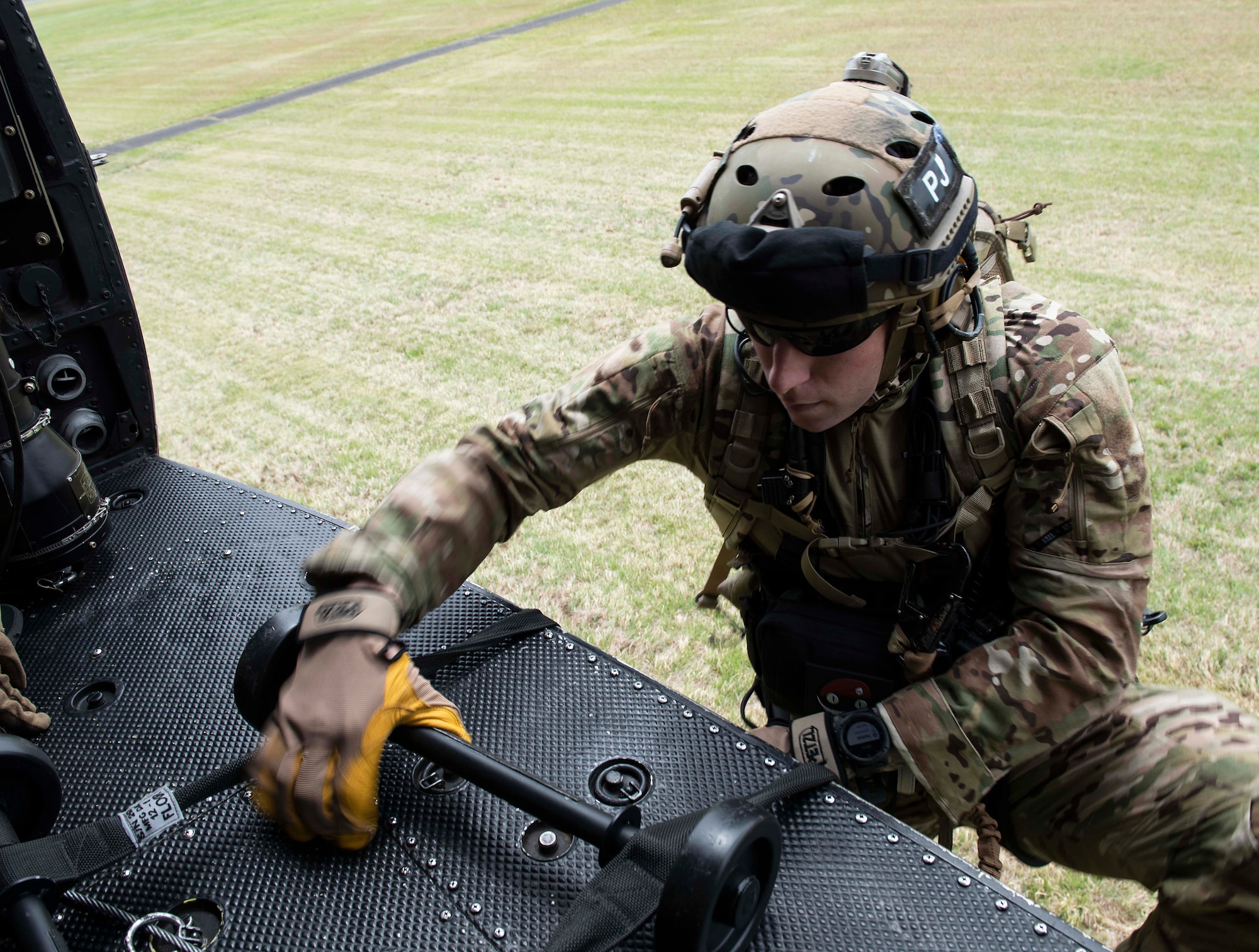A U.S. Air Force  Airman climbs into a UH-1N Iroquois helicopter