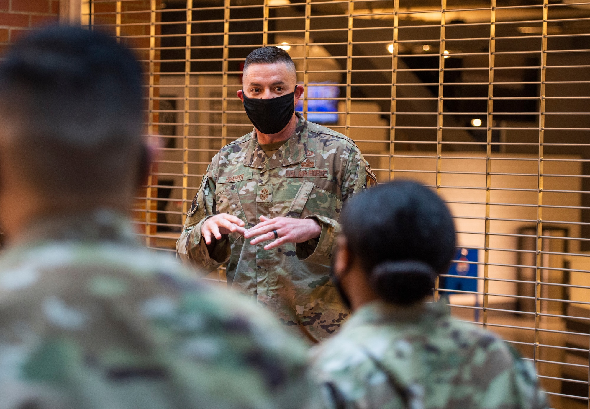 U.S. Air Force Chief Master Sgt. Jason Shaffer, 88th Air Base Wing command chief, talks with Airmen from the 88th Medical Group, Wright-Patterson Air Force Base, Ohio, who are assigned to  at the federally-supported Community Vaccination Center (CVC) at Ford Field in Detroit, Michigan, May 3, 2021. Miller, along with the other members of the wing leadership, visited Detroit to witness first-hand how members of the 88th Medical Group are helping out at the Ford Field CVC which is designed to vaccinate up to 6,000 community members per day. U.S. Northern Command, through U.S. Army North, remains committed to providing continued, flexible Department of Defense support to the Federal Emergency Management Agency as part of the whole-of-government response to COVID-19. (U.S. Air Force photo by Wesley Farnsworth)