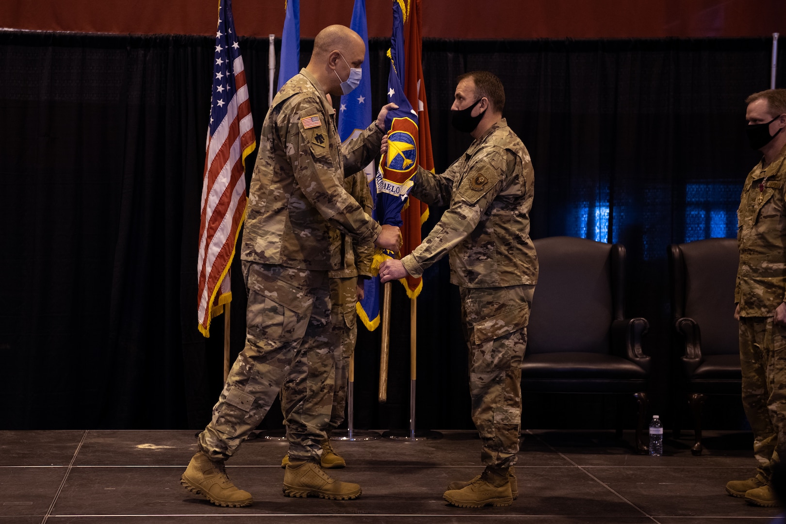 Col. Christopher D. Gries assumes command of the 137th Special Operations Wing from Maj. Gen. Michael Thompson, adjutant general for Oklahoma, at a change of command ceremony at Will Rogers Air National Guard Base (WRANGB) in Oklahoma City, May 1, 2021. Gries was formerly the 137th Operations Group commander and became the 18th wing commander at WRANGB. (U.S. Air National Guard photo by Senior Master Sgt. Andrew M. LaMoreaux)