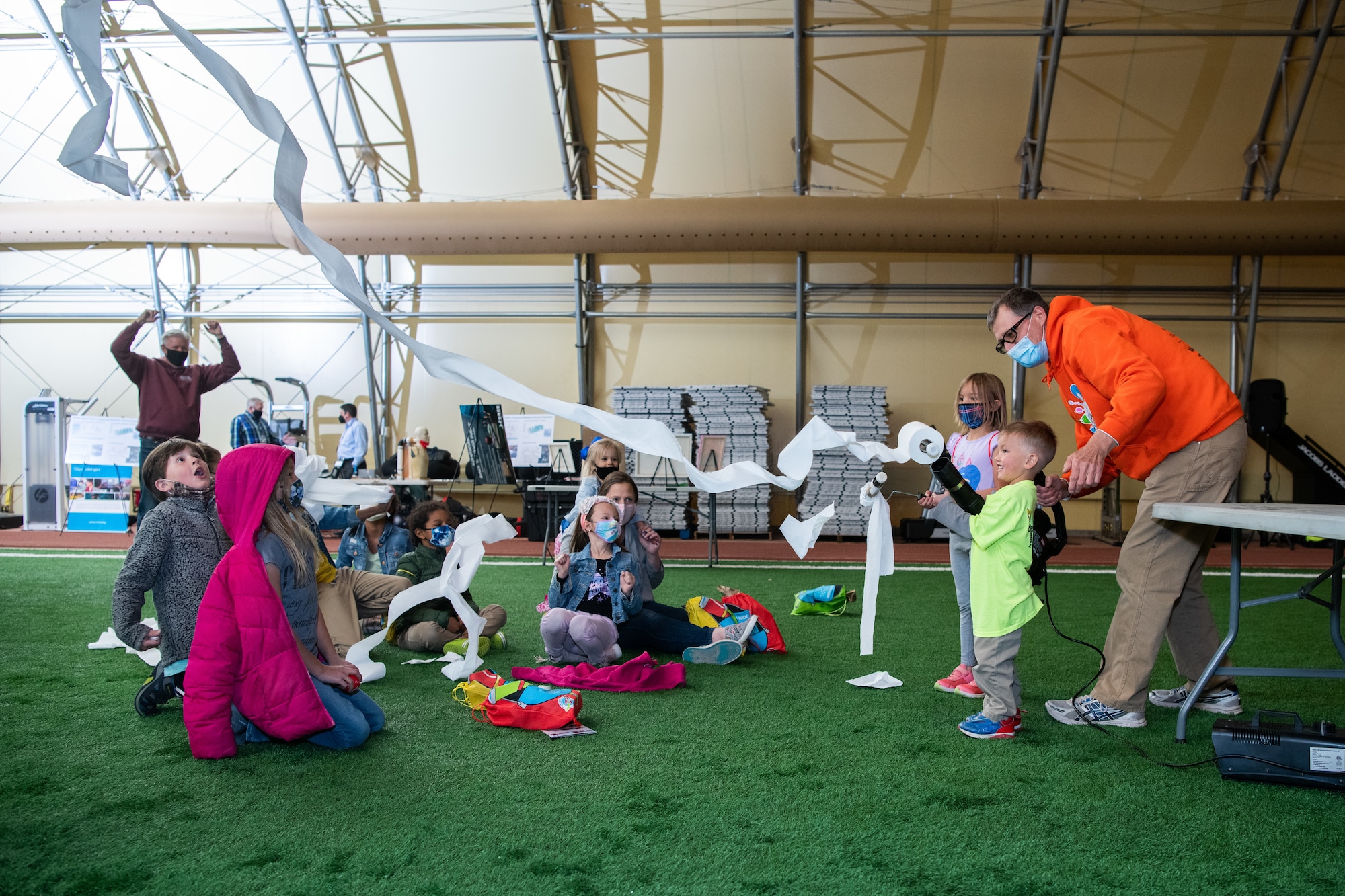 Kids interacting with a scientist during the STEAM fling at Schriever Air Force Base