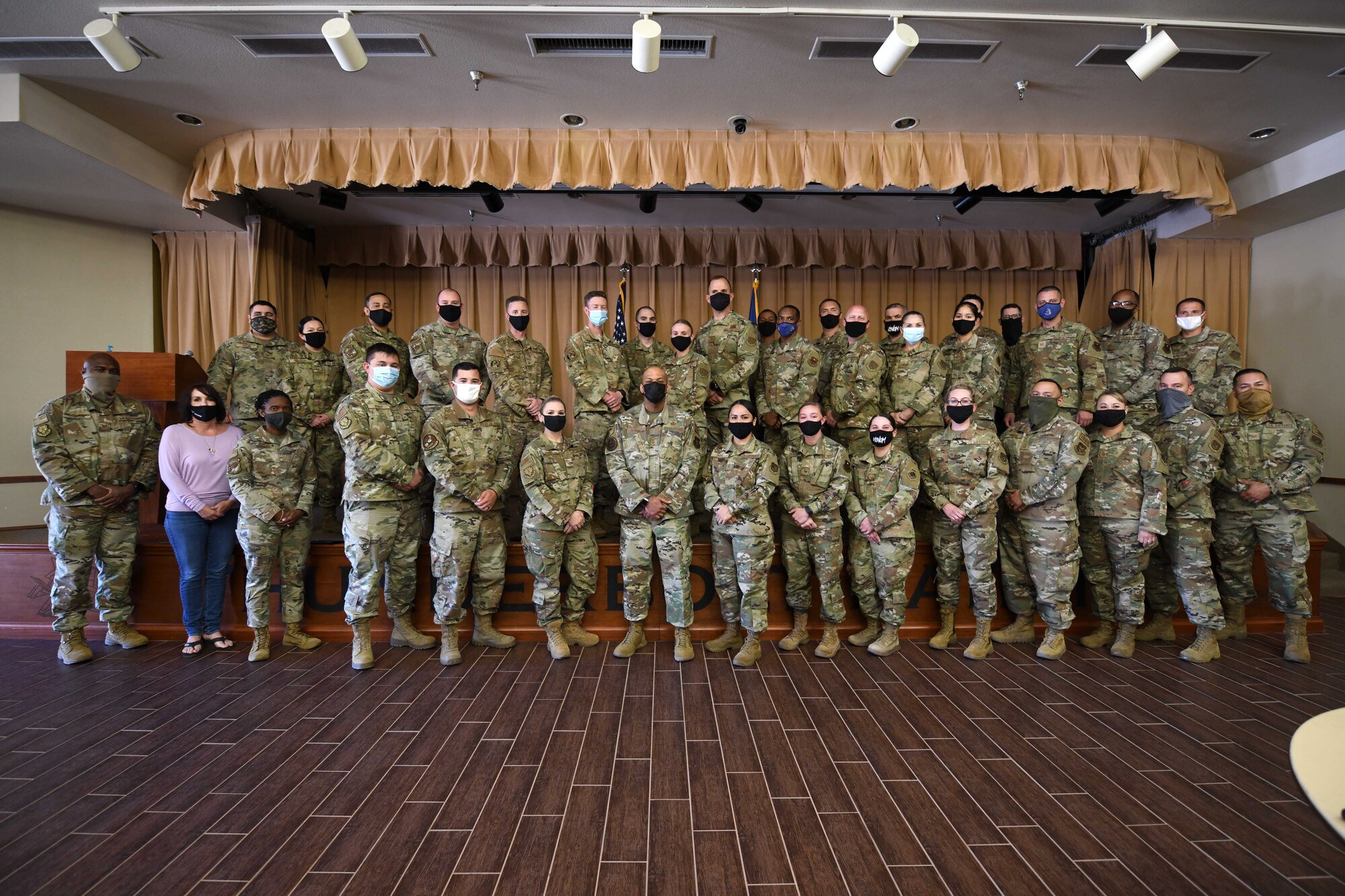 Participants of the first-ever Southwest Regional First Sergeants Symposium pose for a group photo with the Air Force Reserve Command First Sergeant Functional Manager, Chief Master Sgt. Travon Dennis, at Luke Air Force Base, Ariz., April 26-30. Each day of the symposium was broken down into themes: inspire, empower, challenge, give back, and capstone.