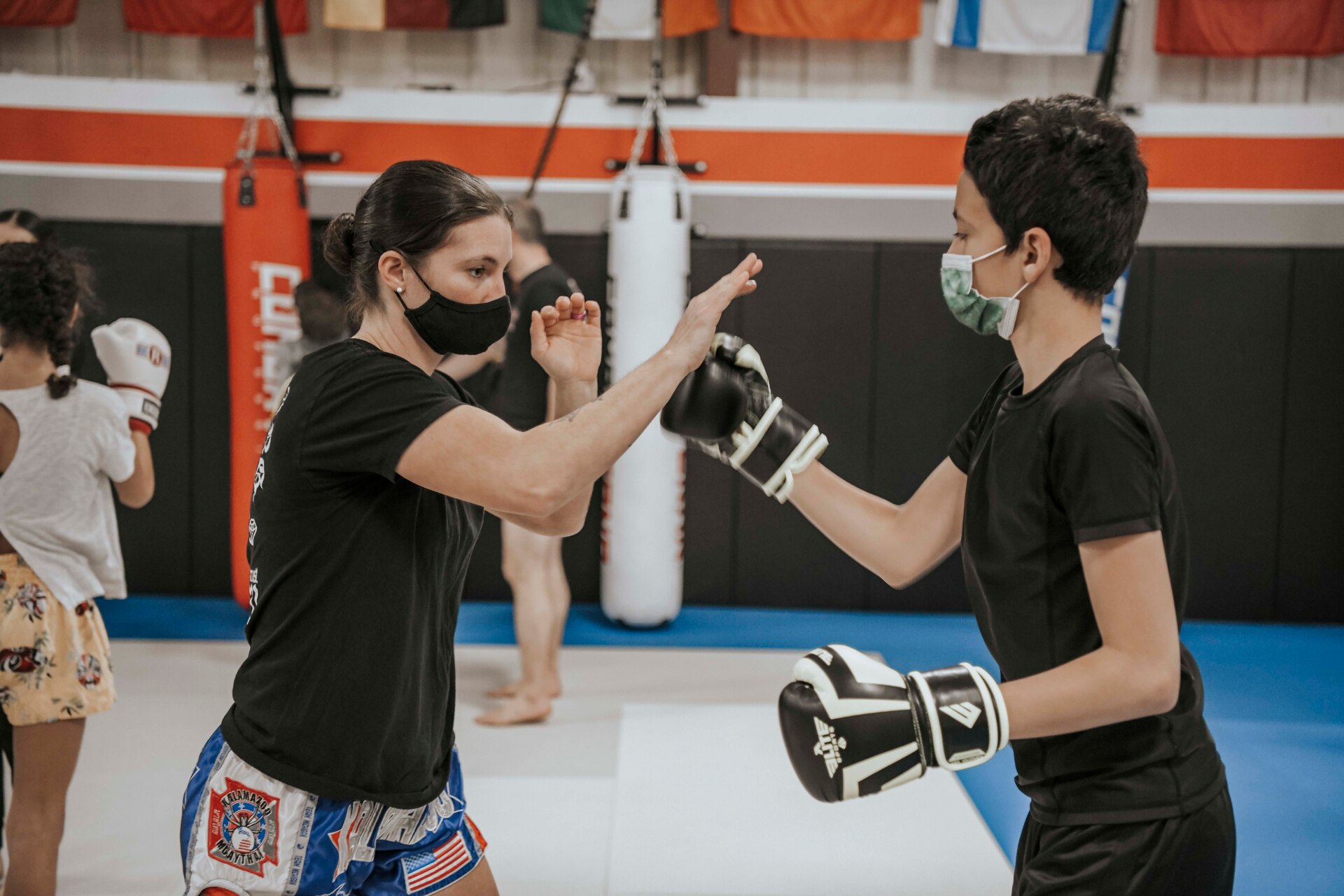 Michigan Air National Gjuard Master Sgt. Destiny Taylor, 110th Wing finance specialist, spars with a teen boy during a youth training class in Kalamazoo, Michigan, April 22, 2021.
