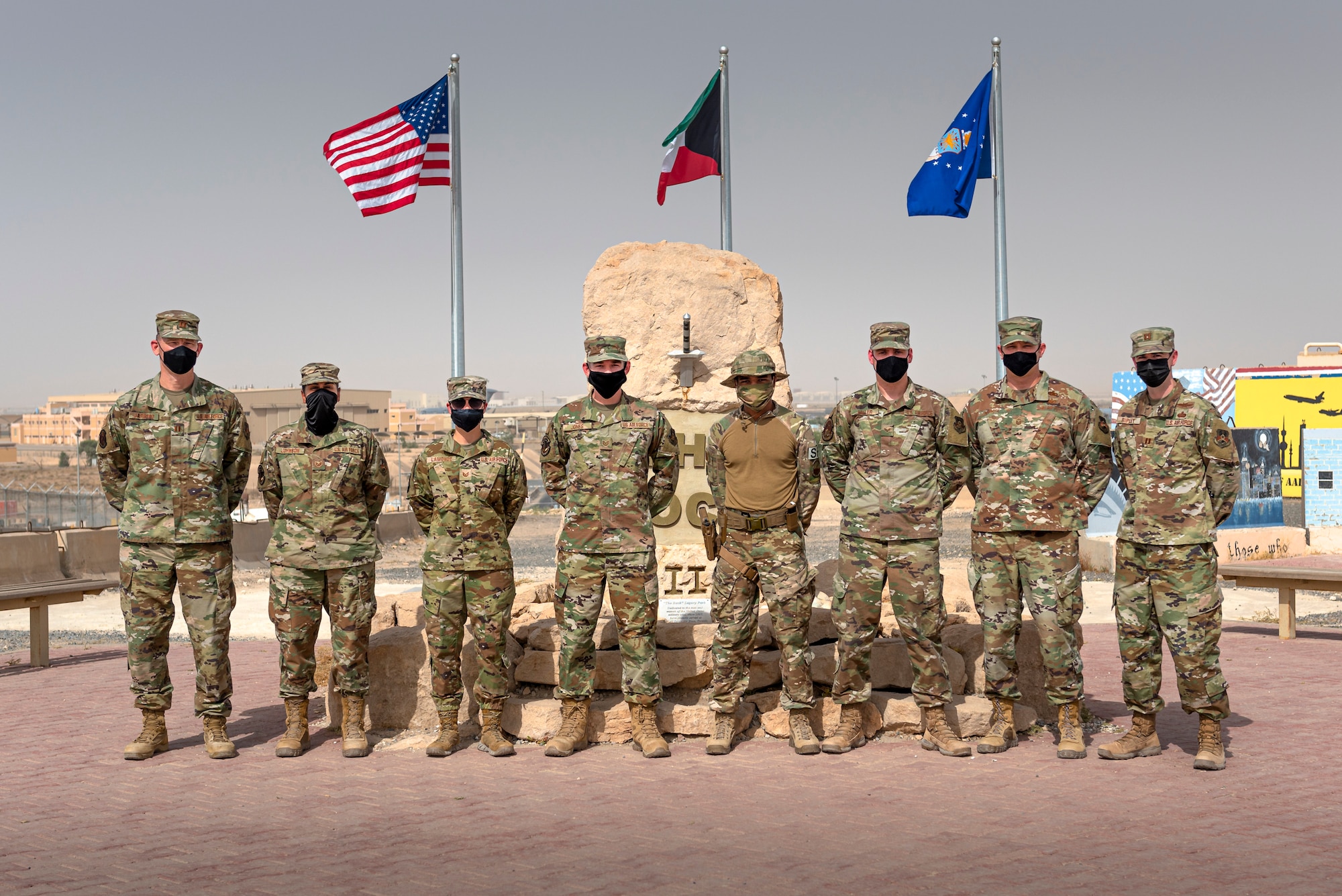 A photo of U.S. Airmen posing for a photo