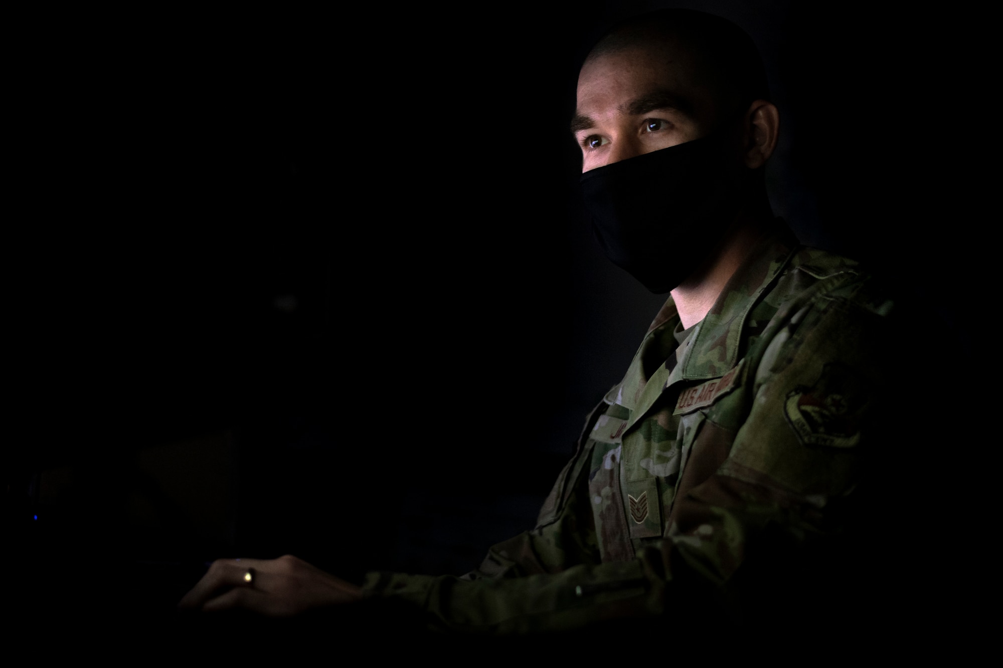 A photo of a U.S. Airman using a computer