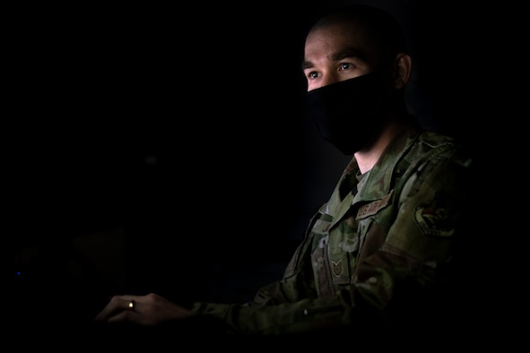 A photo of a U.S. Airman using a computer