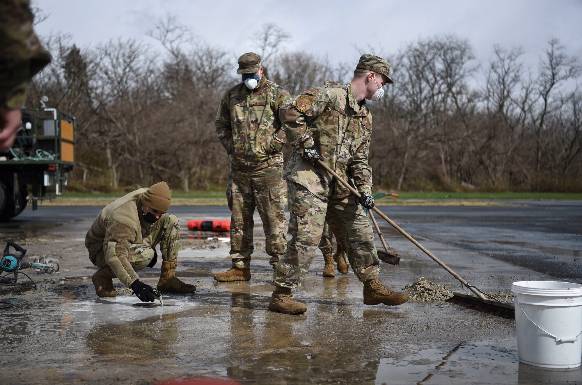 U.S. Air Force Airmen assigned to the 35th Fighter Wing learn to lay cement during Agile Combat Employment training at Misawa Air Base, Japan, April 9, 2021.