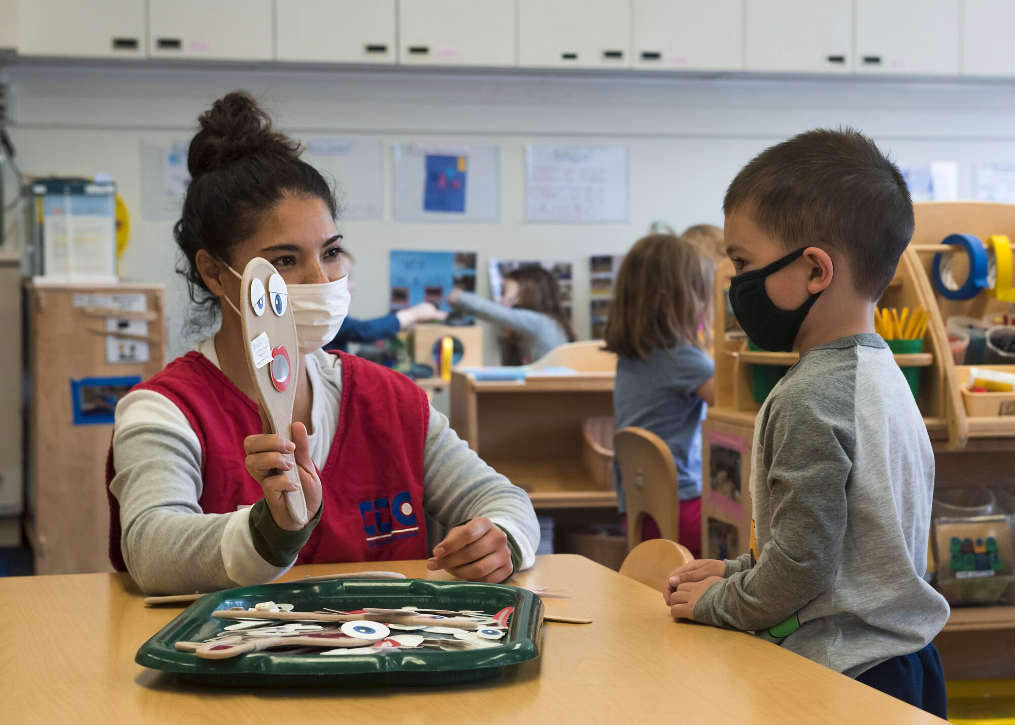 A Yoiko Child Development Center teacher holds a toy for a student during class at Misawa Air Base, Japan, April 26, 2021.