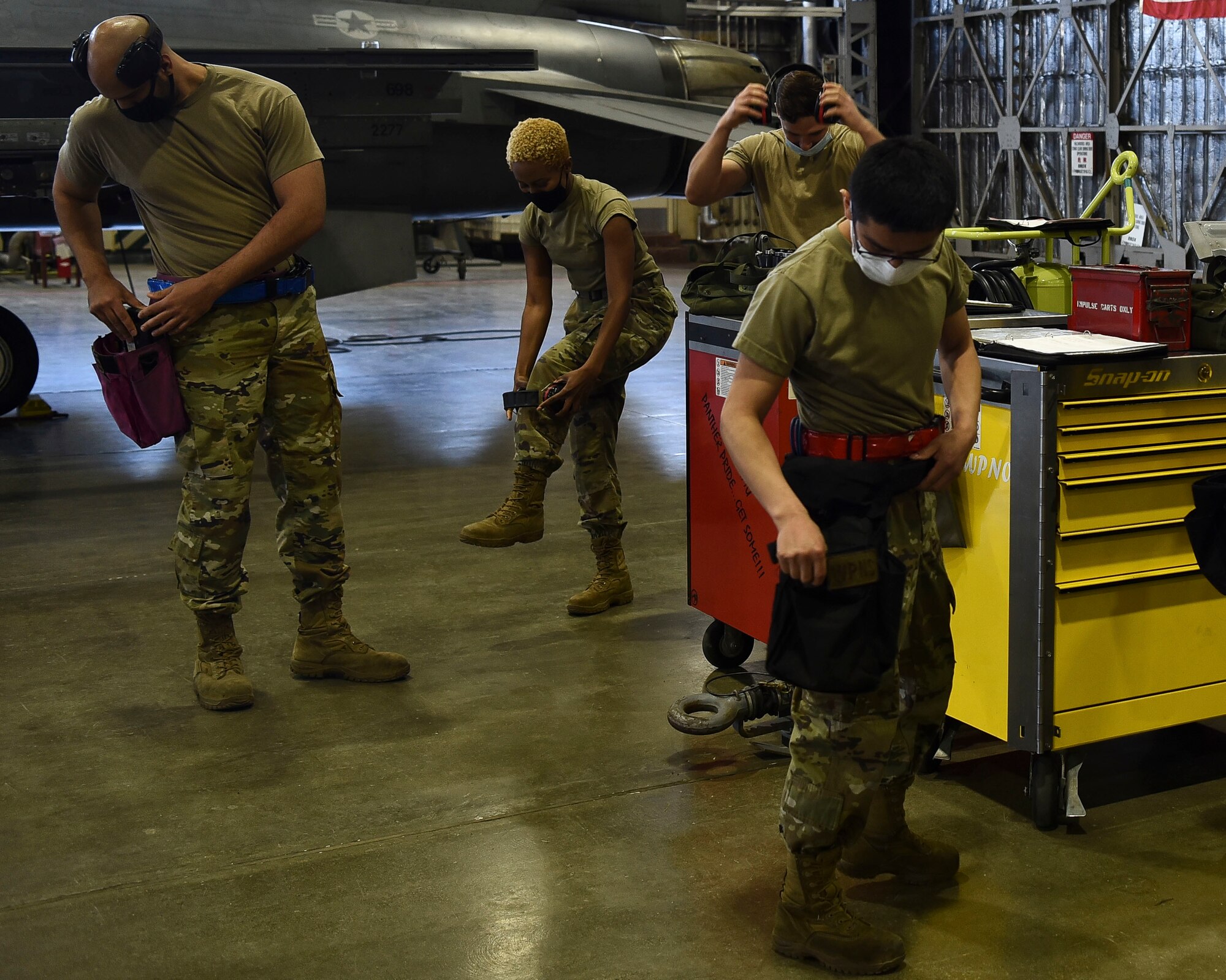 U.S. Air Force Airmen equip tools they’ll need throughout the first quarter load competition at Misawa Air Base, April 23, 2021.