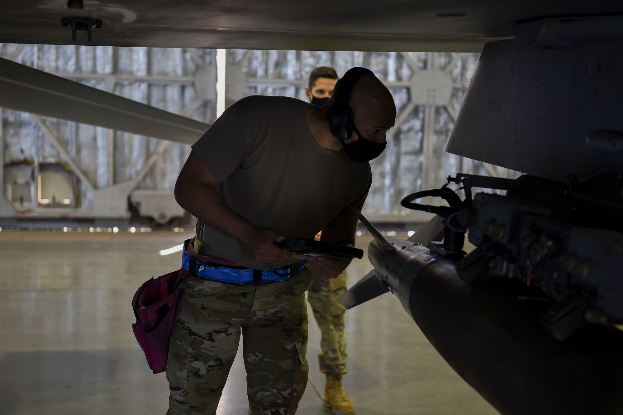U.S. Air Force Staff Sgt. Jonathan Gonzalez, 13th Aircraft Maintenance Unit load crew chief, reviews technical orders during the first quarter load competition at Misawa Air Base, April 23, 2021.