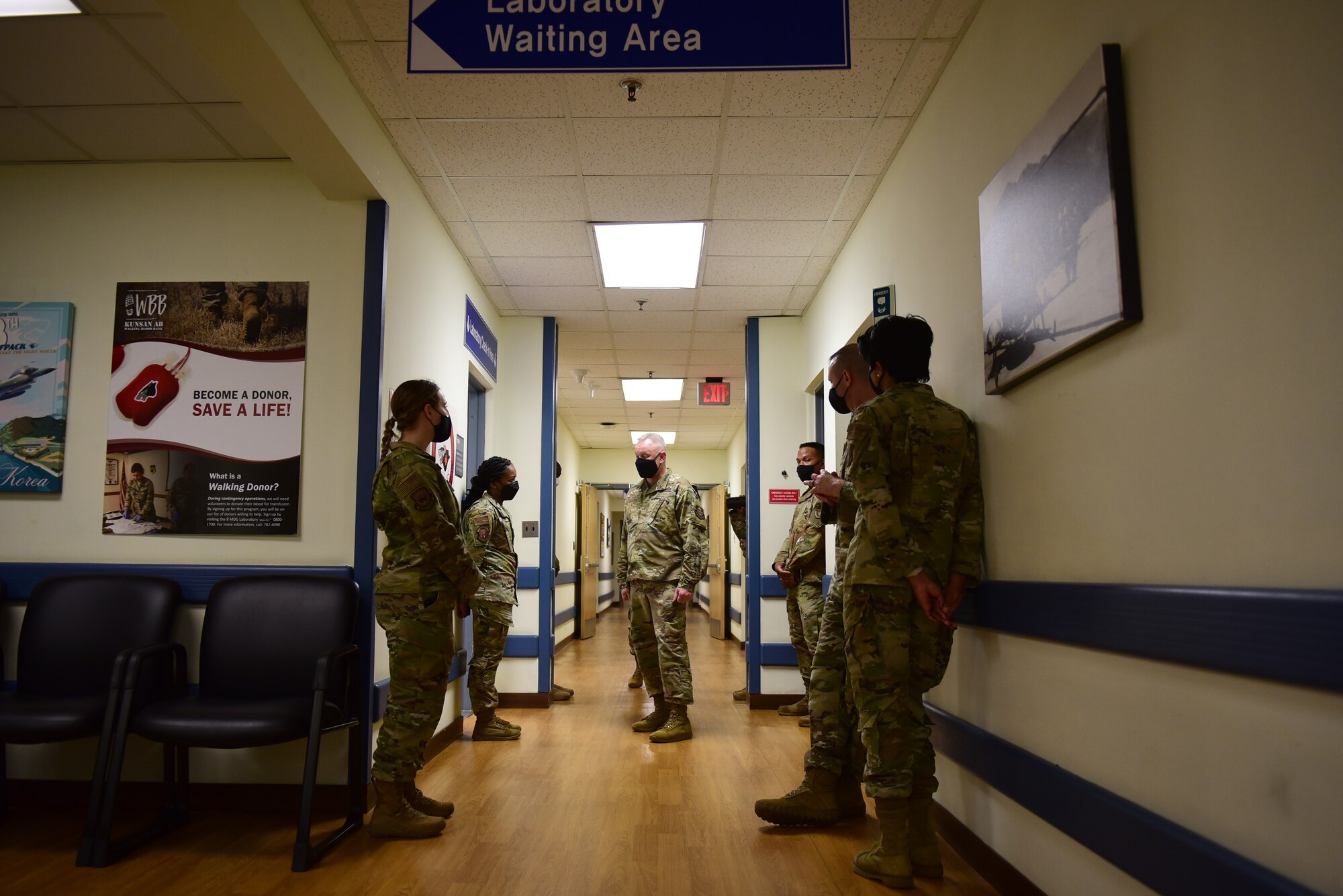 Chief Master Sgt. Phil Hudson, 7th Air Force command chief, (center), speaks with 8th Medical Group Airmen during a 7th AF leadership visit at Kunsan Air Base, Republic of Korea, May 13, 2021. During the visit, Hudson toured many units around base, coined outstanding Airmen and held multiple mentorship sessions. (U.S. Air Force photo by Senior Airman Suzie Plotnikov)