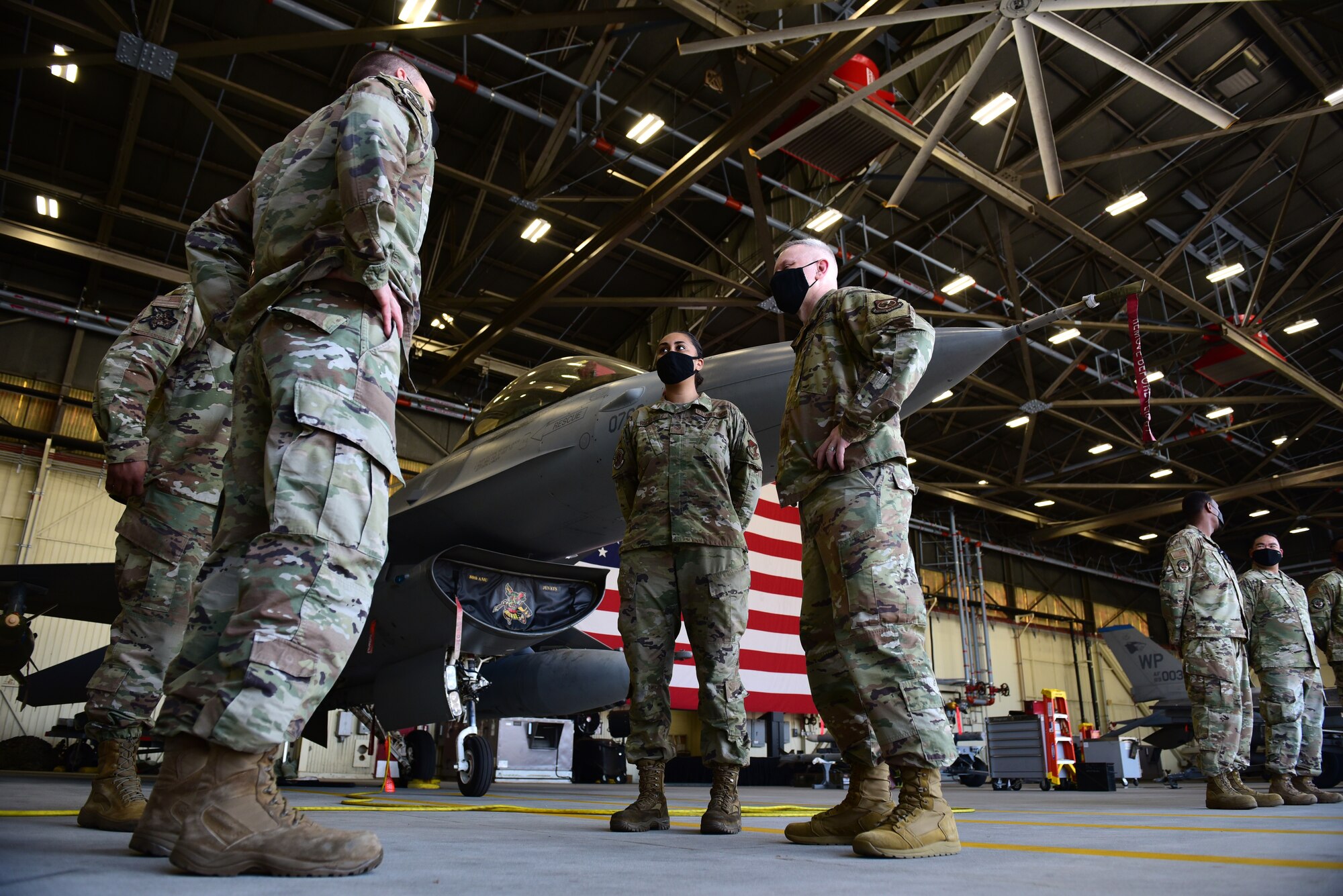 Eighth Maintenance Squadron Airmen speak with Chief Master Sgt. Philip Hudson, 7th Air Force command chief, during a 7th AF leadership visit at Kunsan Air Base, Republic of Korea, May 13, 2021. During the visit, Hudson toured many units around base, coined outstanding Airmen and held multiple mentorship sessions. (U.S. Air Force photo by Senior Airman Suzie Plotnikov)