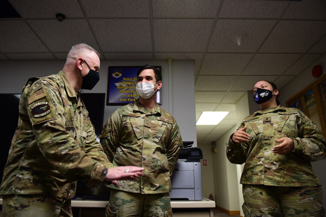 Chief Master Sgt. Phil Hudson, 7th Air Force command chief, speaks with Staff Sgt. Andrew Grimm, 8th Comptroller Squadron budget analyst, and 1st Lt. Manervia McDonald, 8th CPTS flight commander of financial analysis during a 7th AF leadership visit at Kunsan Air Base, Republic of Korea, May 12, 2021. During the visit, Hudson toured many units around base, coined outstanding Airmen and held multiple mentorship sessions. (U.S. Air Force photo by Senior Airman Suzie Plotnikov)