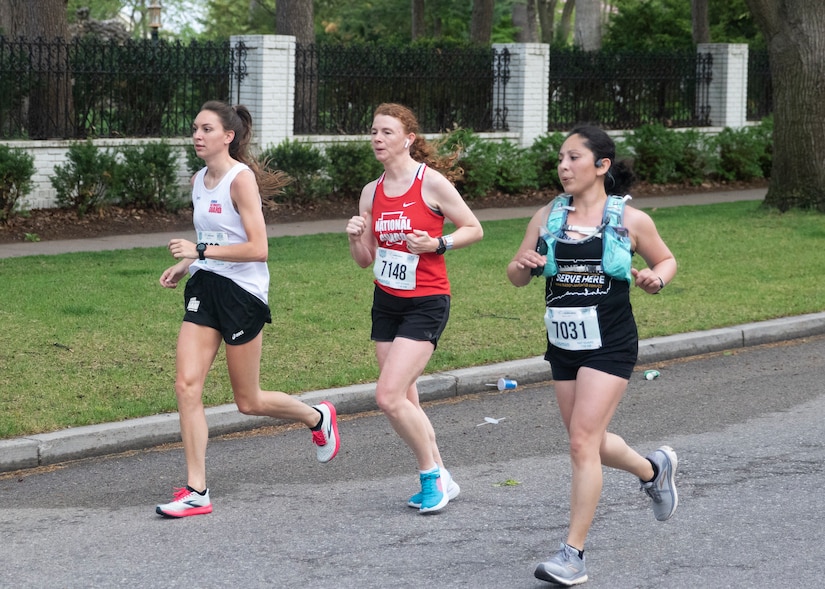 Chief Warrant Officer 3 Amanda Nesbitt, center, runs in the Lincoln Marathon in Lincoln, Nebraska, on May 2. Nesbitt was the 18th female Guard member to finish and 88th female overall.