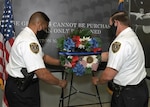 Yesterday, in honor of National Police week and in remembrance of fallen law enforcement officers, DIA Police Chief Andre Tibbs (left) and Deputy Chief John Richter (right) place a wreath at DIA Headquarters. (Photo by Dave Richards, OCC)