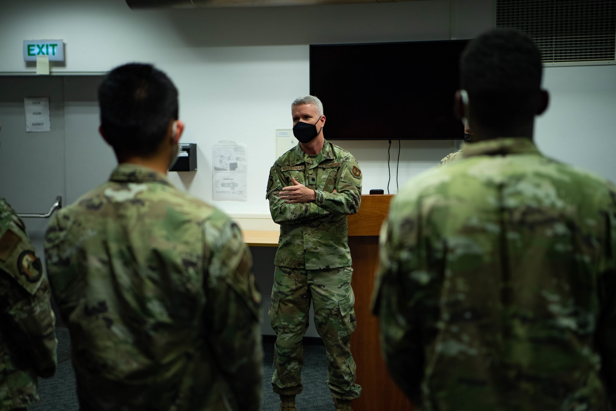 Airmen hold graduation certificates