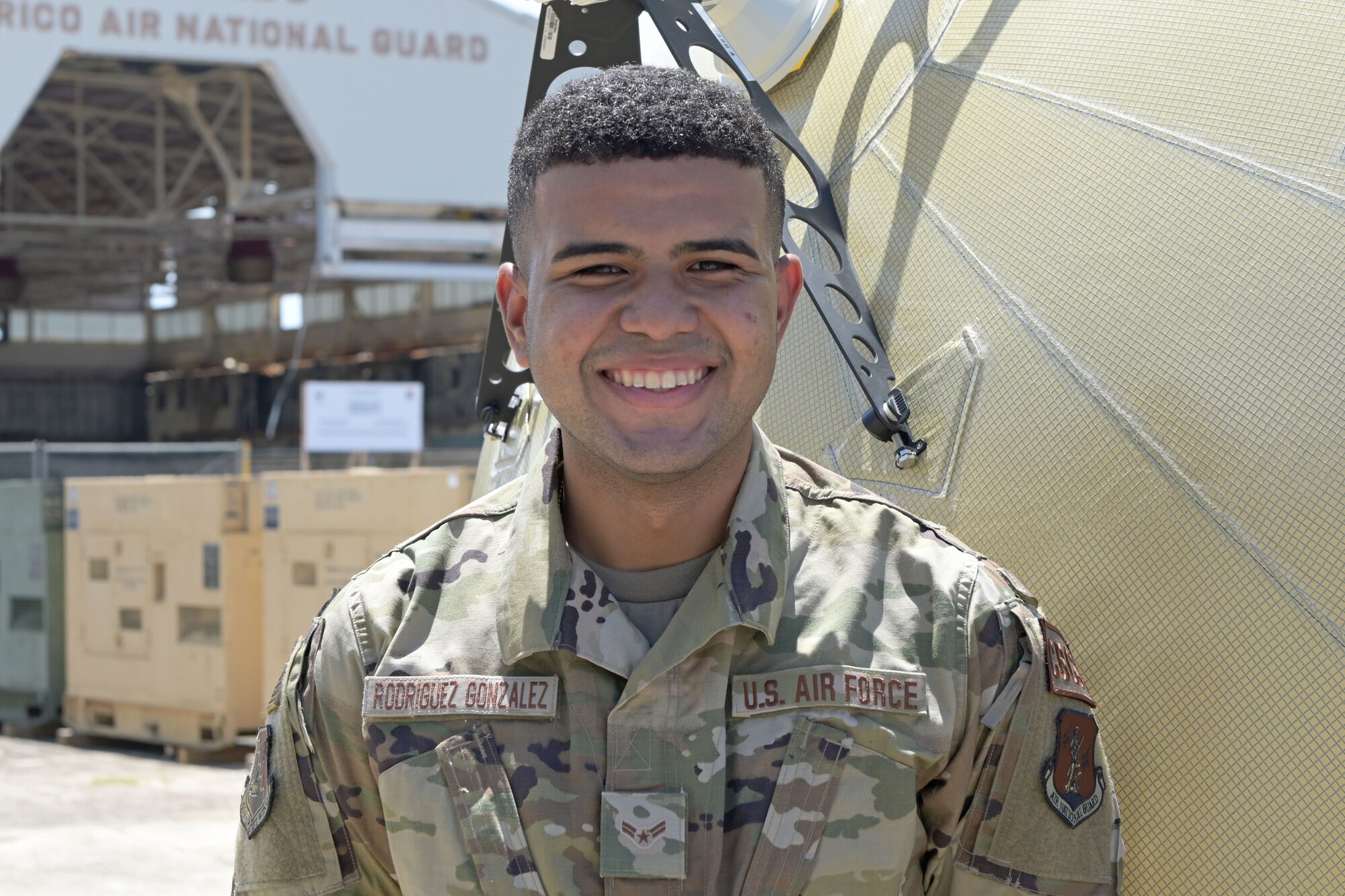 U.S. Airman 1st Class Tyron Rodriguez, transmission systems specialist, 156th Combat Communications Squadron, poses for a picture at Muñiz Air National Guard Base, Carolina Puerto Rico, May 5, 2021. (U.S. National Guard photo by Staff Sgt. Eliezer Soto)