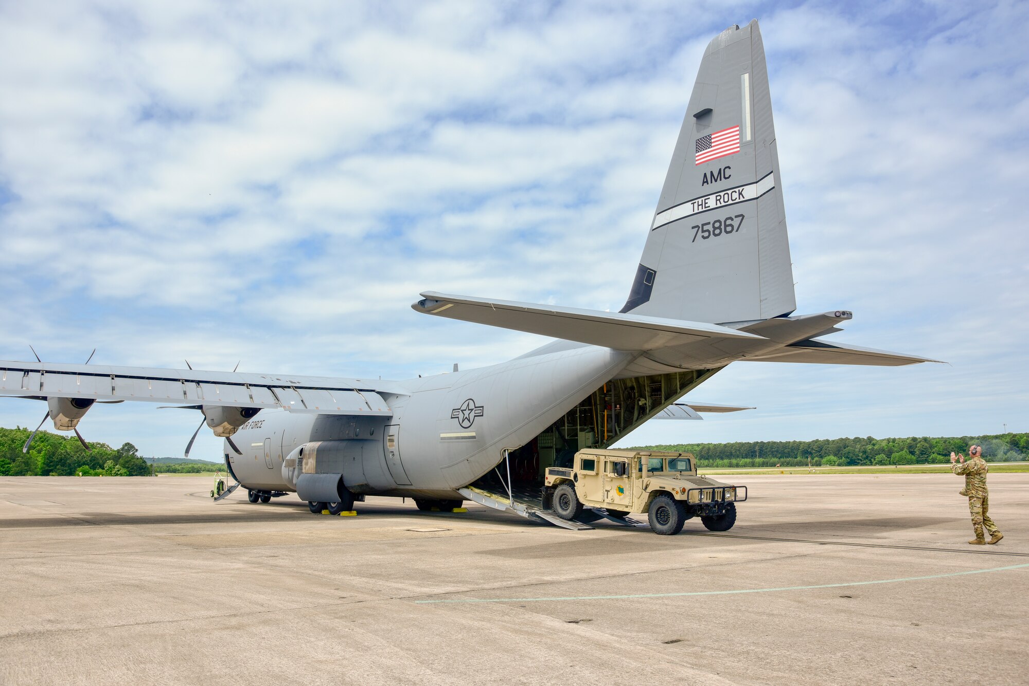 U.S. Air Force Reserve Senior Airman Richard Brewster, 327th Airlift Squadron loadmaster, loads a Humvee onto a C-130J Super Hercules at Little Rock Air Force Base, Arkansas, on May 12, 2021. The Air Force Reserve 327th Airlift Squadron provided agile combat support and cargo handling training opportunities to the 442d Fighter Wing during a training event. (U.S. Air Force photo by Senior Airman Kalee Sexton)