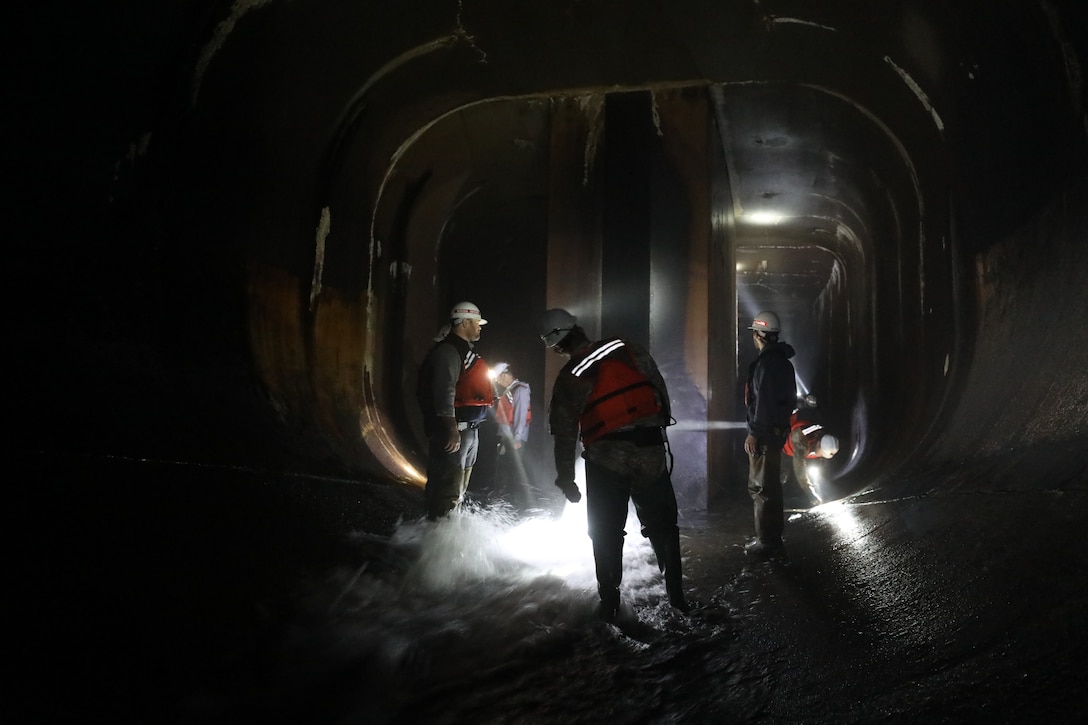 The USACE Norfolk District inspection team performs a primarily visual inspection of the major dam safety components at the Gathright Dam outlet tunnel on May 11 during the semi-annual dam inspection. Facility personnel inspect the dam daily under normal operating conditions and more frequently during high-pool levels. (U.S. Army photo/Breeana Harris)