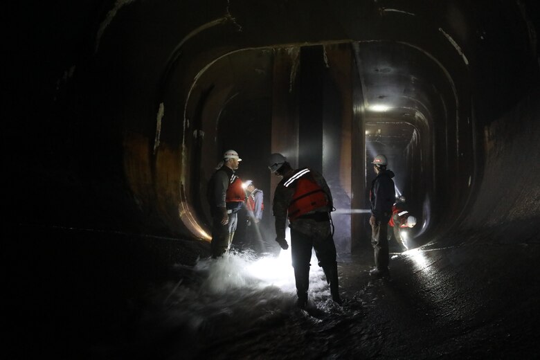 The USACE Norfolk District inspection team performs a primarily visual inspection of the major dam safety components at the Gathright Dam outlet tunnel on May 11 during the semi-annual dam inspection. Facility personnel inspect the dam daily under normal operating conditions and more frequently during high-pool levels. (U.S. Army photo/Breeana Harris)
