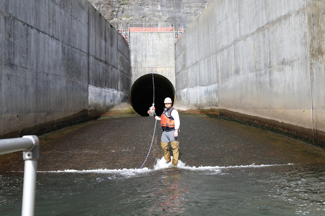 Anthony Lockidge, supervisory facility operations specialist and Dam operator for USACE Norfolk District waits at the entrance of the Gatheright Dam outlet tunnel to guide the inspection team to the tunnel on May 11 during the semi-annual dam inspection. (U.S. Army photo/Breeana Harris)
