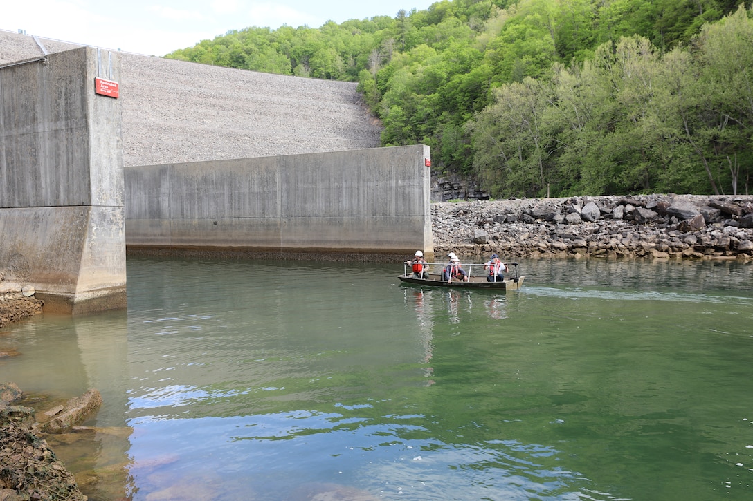 The USACE Norfolk District inspection team takes a jon boat to the entrance of the outlet tunnel of the Gathright Dam to perform a primarily visual inspection of the major dam safety components on May 11 during the semi-annual dam inspection. (U.S. Army photo/Breeana Harris)