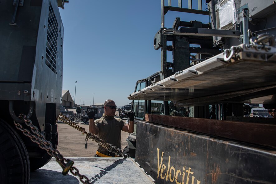 A photo of an Airman processing for an exercise
