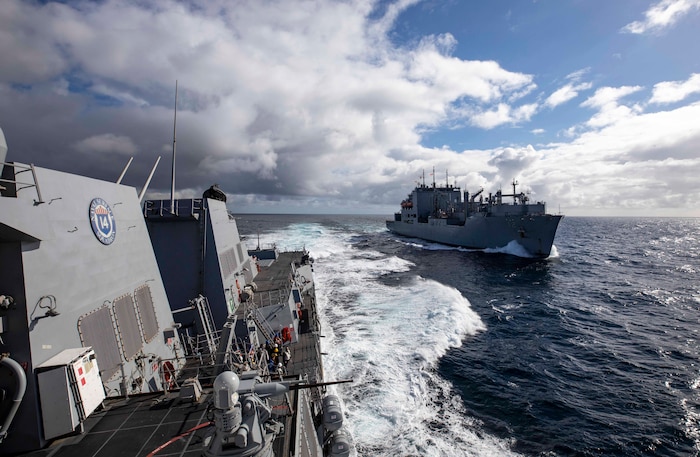 The Arleigh Burke-class guided-missile destroyer USS Paul Ignatius (DDG 117) pulls away from the Military Sealift Command dry cargo and ammunition ship USNS William McLean (T-AKE 12) after a replenishment-at-sea evolution.