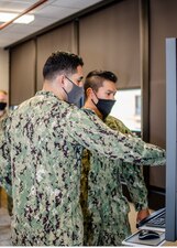 NORFOLK, Va. (May 14, 2021) Sailors at the Center for Naval Aviation Technical Training (CNATT) Unit Norfolk use a Multipurpose Reconfigurable Training System (MRTS) 3D® system.  The MRTS 3D® Electromagnetic Aircraft Launch System (EMALS) provides high-fidelity operator and maintenance catapult system training for the U.S. Navy Ford-class aircraft carriers, which replicates the control room, generator room and flight deck crew using avatars. The MRTS 3D® EMALS simulation is a low-cost solution that includes both a lab and classroom.  (U.S. Navy photo)