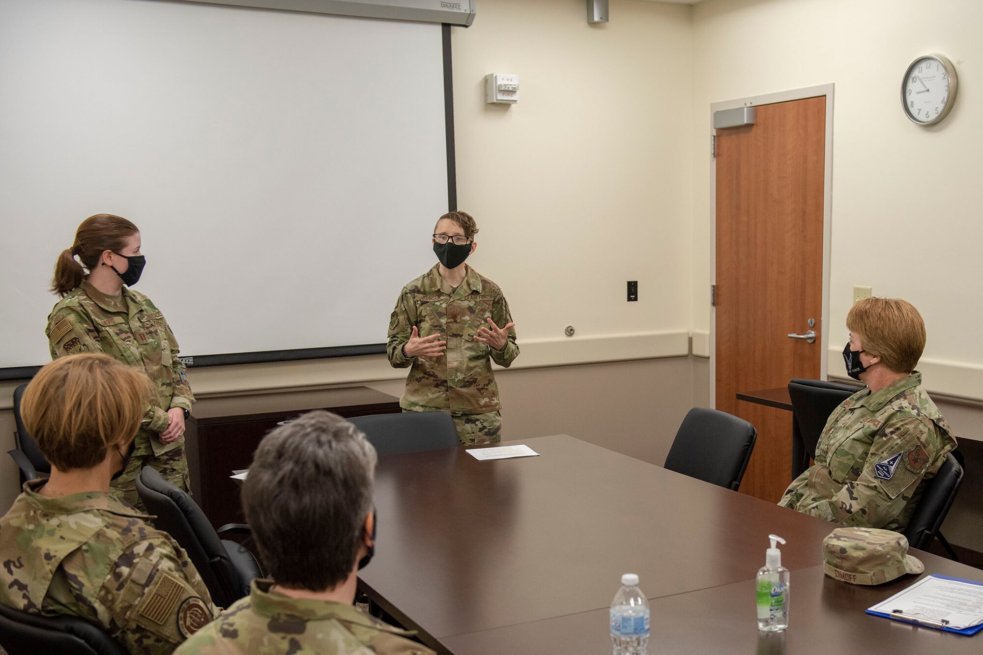 Lt. Gen. Dorothy Hogg, U.S. Air Force surgeon general and Chief Master Sgt. Dawn M. Kolczynski, medical enlisted force and enlisted corps chief, are briefed by Maj. Laura Johnson, 341st Medical Group mental health flight commander April 29, 2021, at the base clinic on Malmstrom Air Force Base, Mont.