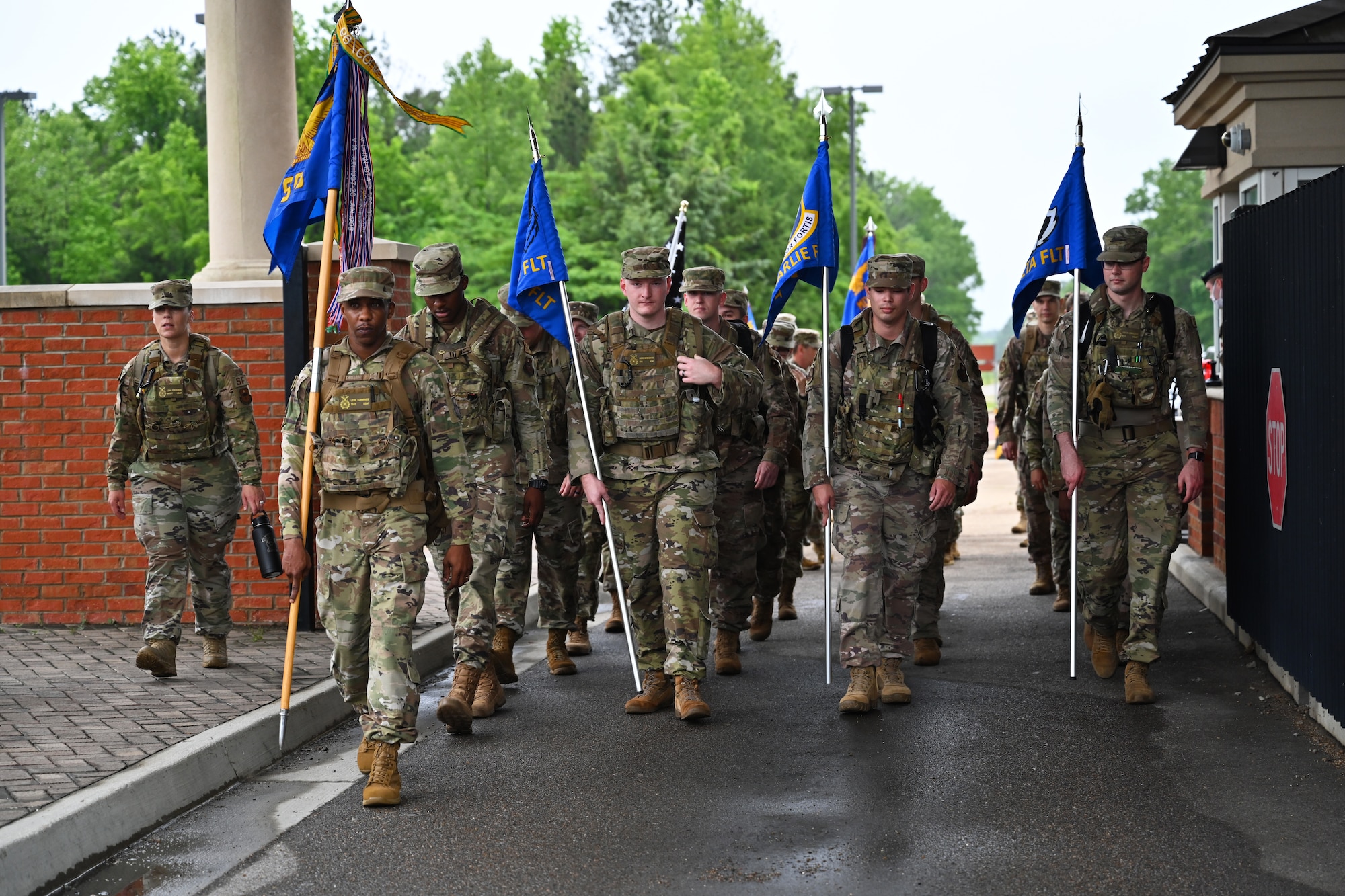 Members of Team BLAZE march through the main gate May 10, 2021, on Columbus Air Force Base, Mississippi. National Police Week at Columbus AFB is held to recognize security forces and local law enforcement personnel who defend the base. (U.S. Air Force photo by Senior Airman Jake Jacobsen)