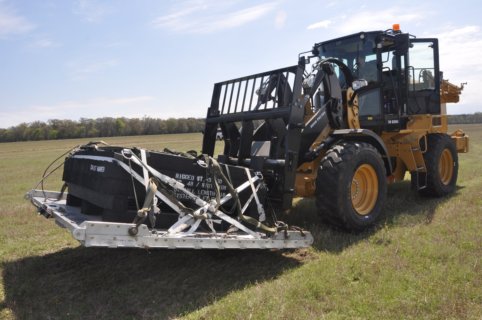 a forklift preparing to load cargo on a truck