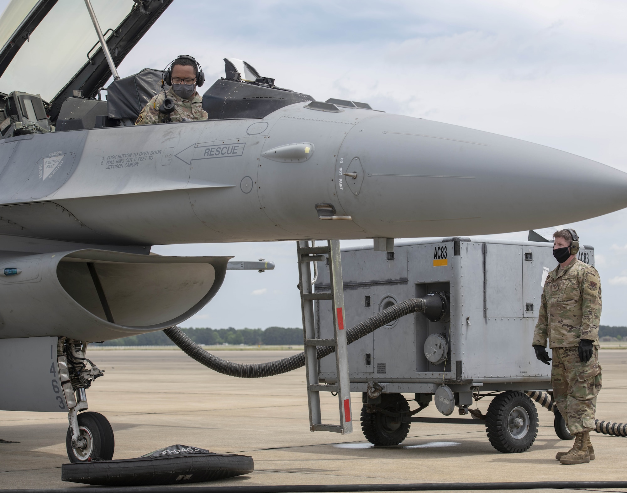 Photo of Airmen on flightline