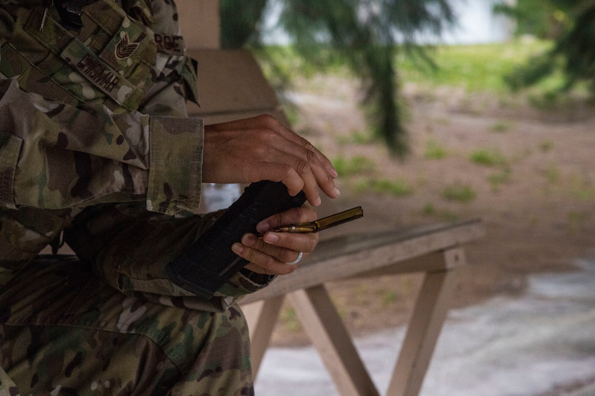 An Airman with the 6th Security Forces Squadron (SFS) loads a magazine with bullets at MacDill Air Force Base, Florida, May 13, 2021.