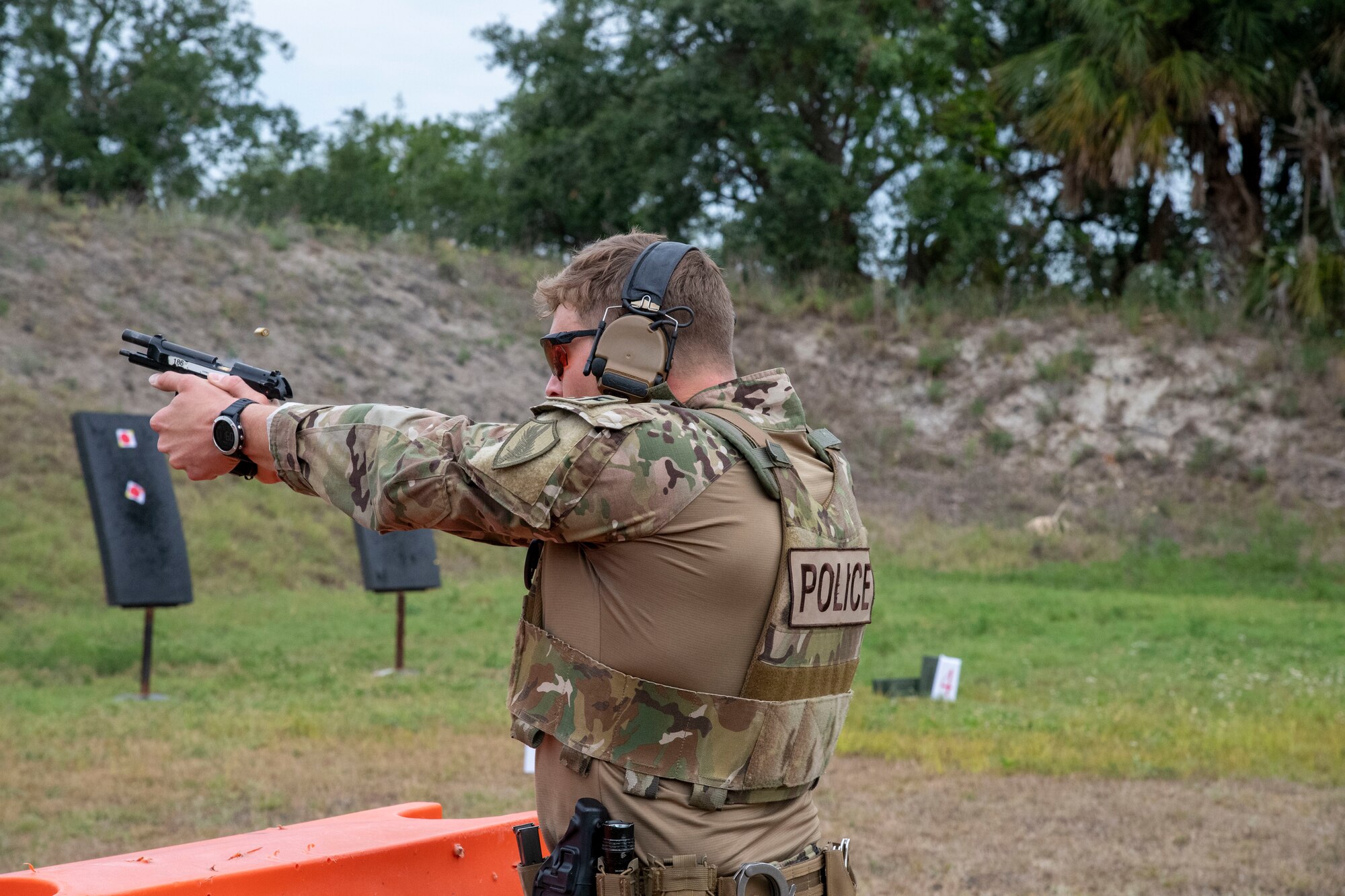 Capt. Jared Hafich, a force protection action officer with U.S. Central Command, discharges his weapon at MacDill Air Force Base, Florida, May 13, 2021.