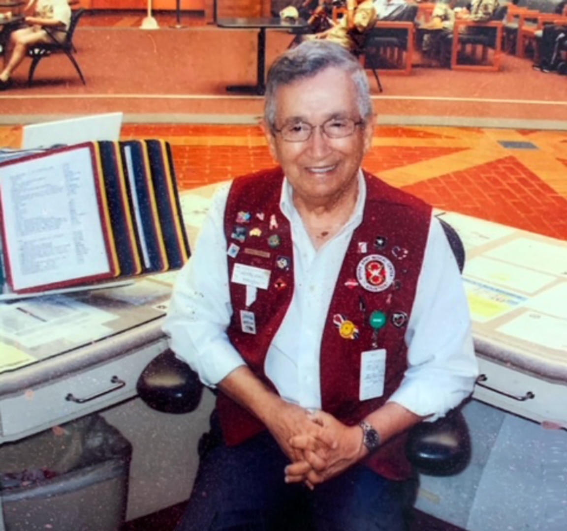 Victor Lopez volunteers at the Brooke Army Medical Center information desk.