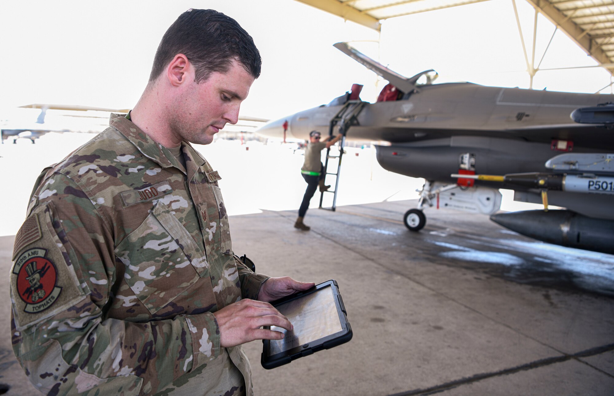 Tech. Sgt. Jonathan Judd, 310th Aircraft Maintenance Unit flight line expediter, uses the KILA app May 14th, 2021, at Luke Air Force Base, Arizona. The app has been in use at Luke AFB since March 24th, 2021, and has revolutionized the launch and recovery process for the F-35A Lightning II and F-16 Fighting Falcon aircraft. Through streamlined communication and new ways of completing the mission, the Air Force builds its lethality and teamwork to provide airpower anytime, anywhere. (U.S. Air Force photo by Airman 1st Class David C. Busby)