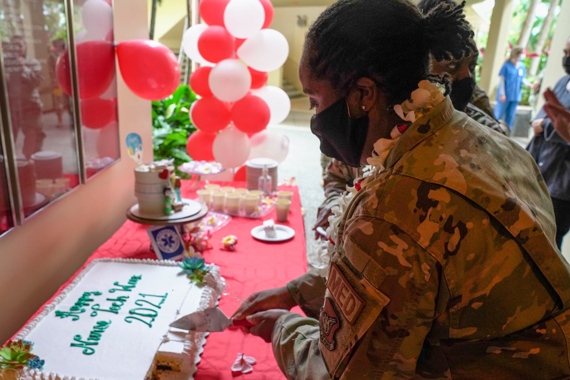 Lt. Col. Lakisha Albertie, 15th Wing Medical Group chief nurse, cuts a cake in celebration of National Nurses Week at Joint Base Pearl Harbor-Hickam, Hawaii, May 6, 2021. The American Nurse Association declared May 6-12 National Nurse Week to highlight nurses’ courage and commitment to keeping communities safe and healthy. (U.S. Air Force photo by Airman 1st Class Makensie Cooper)
