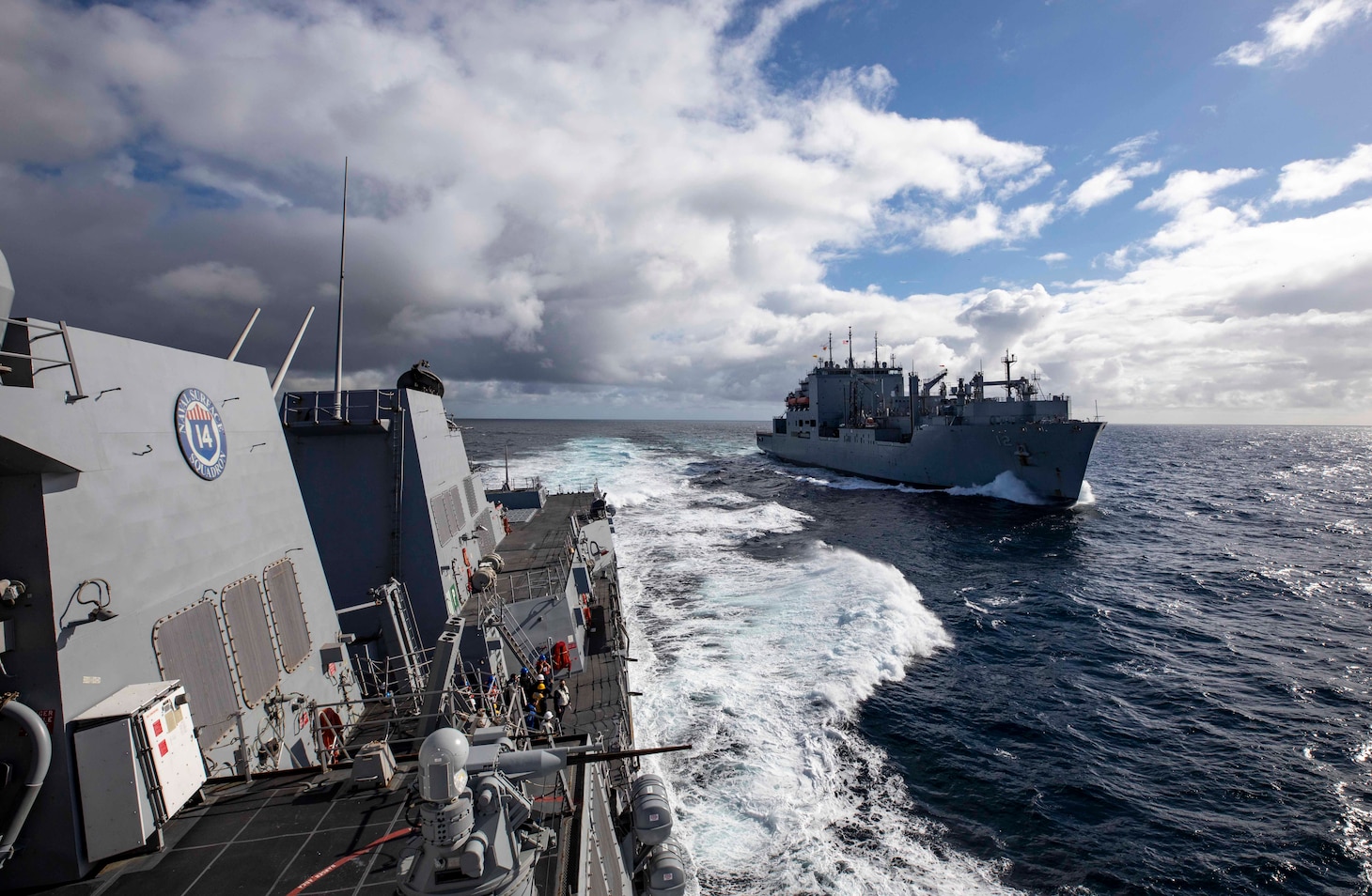 The Arleigh Burke-class guided-missile destroyer USS Paul Ignatius (DDG 117) pulls away from the Military Sealift Command dry cargo and ammunition ship USNS William McLean (T-AKE 12) after a replenishment-at-sea evolution.