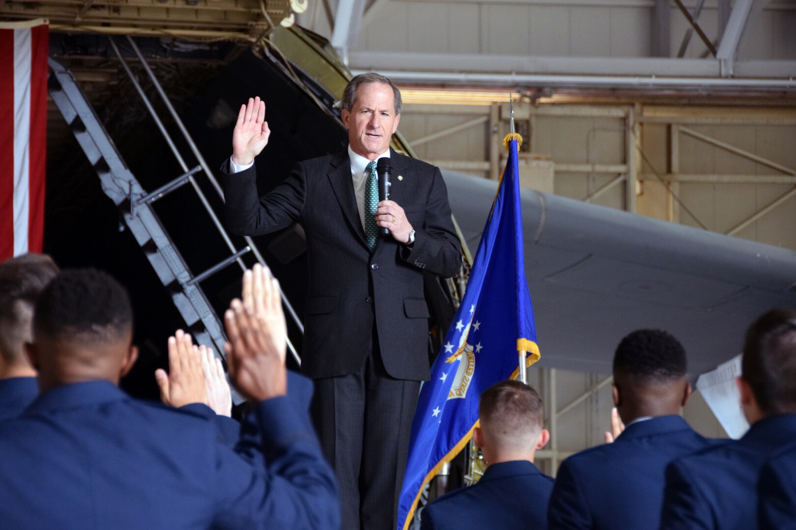 Retired Gen. David Goldfein, the 21st Chief of Staff of the Air Force, administers the Oath of Office to cadets during a commissioning ceremony at Joint Base San Antonio-Lackland, Texas May 14, 2021.