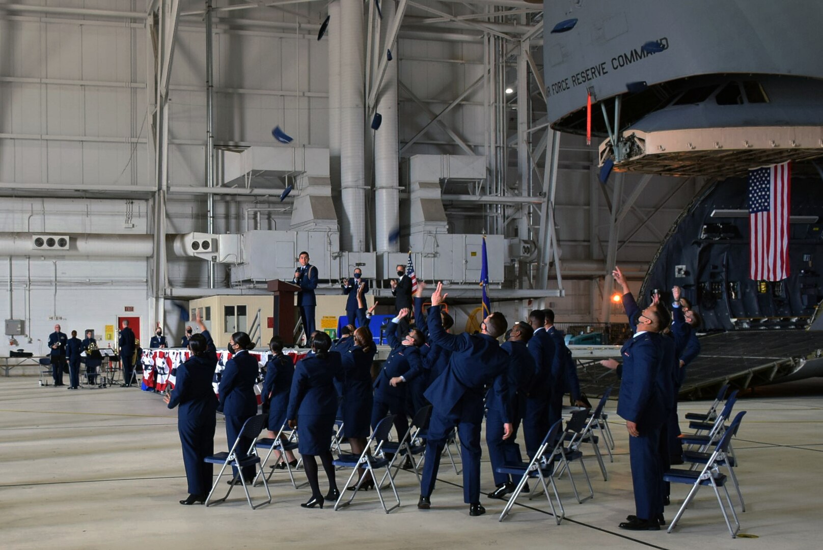 Newly commissioned second lieutenants toss their flight caps into the air in celebration at Joint Base San Antonio-Lackland, Texas on May 14, 2021.