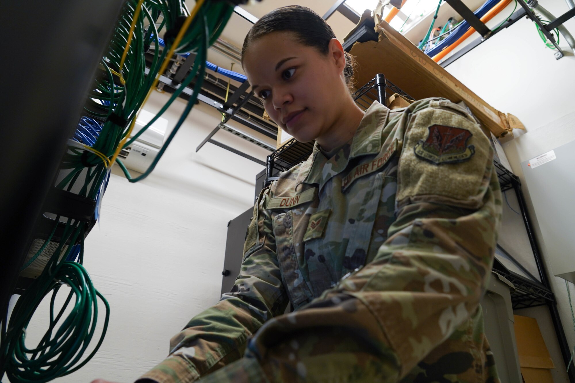 Senior Airman Shayna Dunn, 690th Cyberspace Operations Squadron network manager operator, works on a cyber-related issue at Joint Base Pearl Harbor-Hickam, Hawaii, April 1, 2021. As a member of the 690th COS, Dunn’s unit provides agile cyber combat support to Pacific Air Forces, enabling warfighters the ability to leverage advanced weaponry against adversaries. (U.S. Air Force photo by Senior Airman Jermaine Ayers)