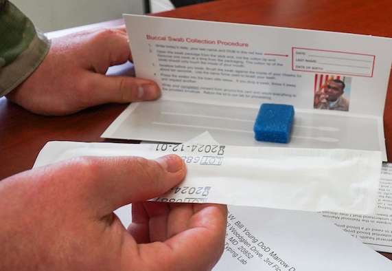 U.S. Air Force Tech. Sgt. John Matlock, the 673d Medical Group chief enlisted executive assistant, displays a bone marrow swab kit at Joint Base Elmendorf-Richardson, Alaska, May 4, 2021. Participants who choose to volunteer as potential bone marrow donors will use the kit to send off their information. JBER is hosting a bone marrow registry drive May 17 to 28 to register JBER personnel through the C.W. Bill Young Department of Defense Bone Marrow Program.