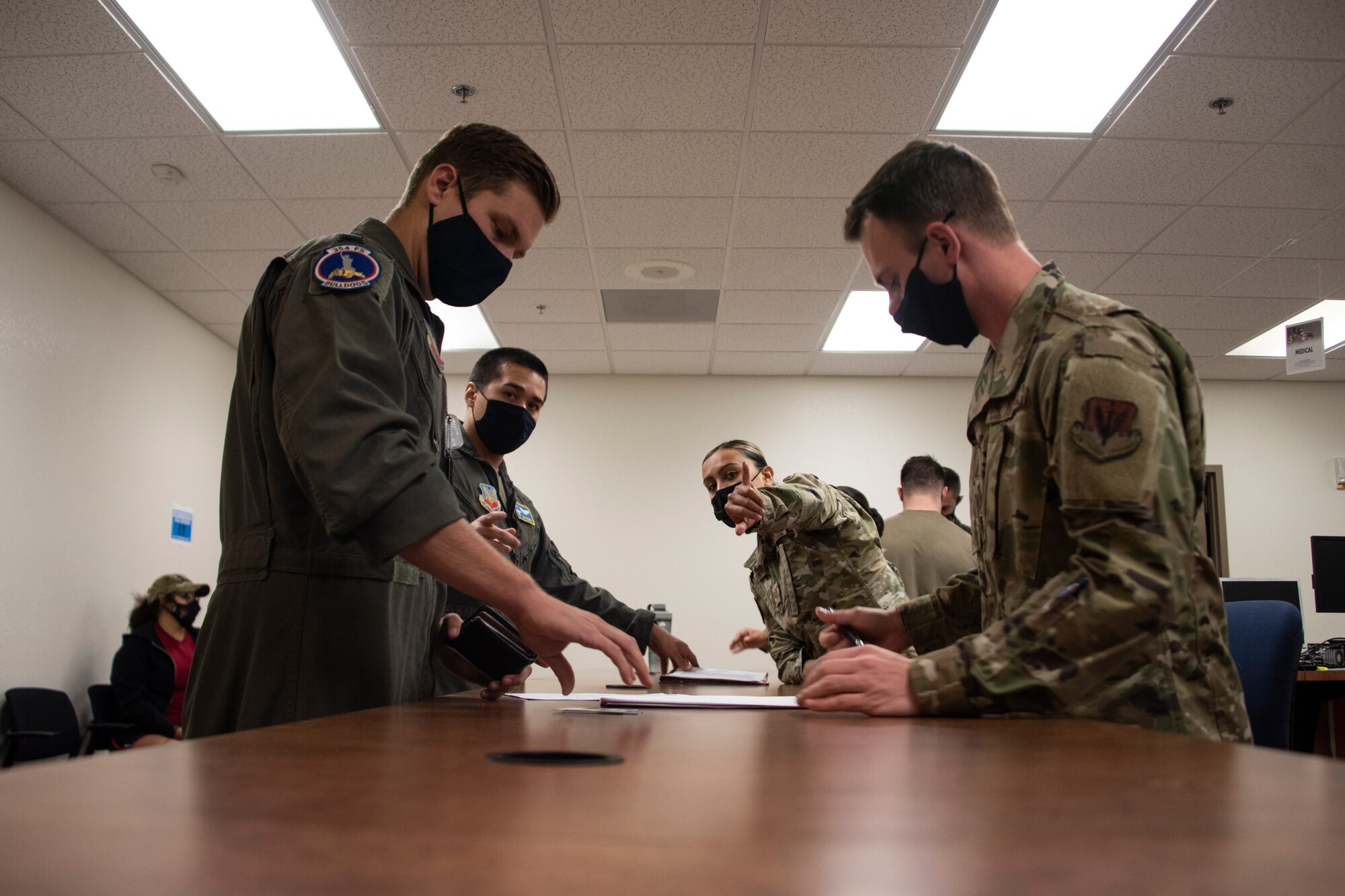 A photo of an Airman processing for an exercise