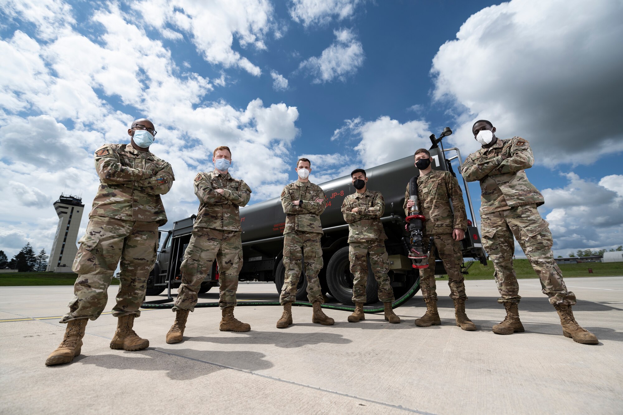 Group portrait of Airmen in front of a fuels truck.